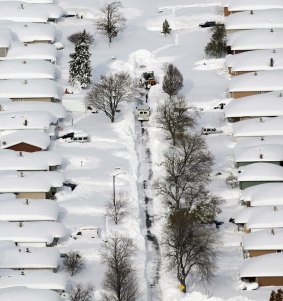 Buried homes: The powerful snowstorm created snowdrifts as high as houses.