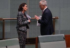 Anne Aly talking to Malcolm Turnbull in Parliament. 