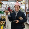 Chae buying olive oil at Mediterranean Wholesalers.