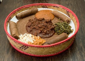 Keyih sebhi (slow-cooked lamb), foul (fava beans with fetta), hamli (Chinese broccoli) and birsen (red split lentils) at Saba's Ethiopian restaurant in Brunswick. 