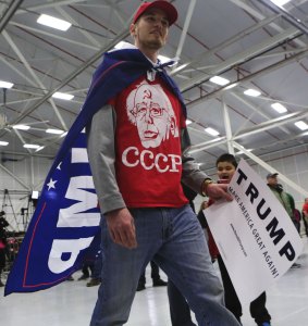 Chris Landcastle of Westmoreland, New York, walks through a hangar before a rally for Republican presidential candidate Donald Trump.