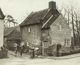 The cottage that Captain Cook never lived in just before it was dismantled and packed in February, 1934. 