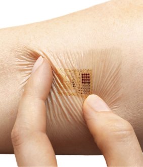 Smart ink: A model wears a health-monitoring smart tattoo being developed by MC10 which is designed to transmit information about the wearer's vital signs to smart phones or other devices. 