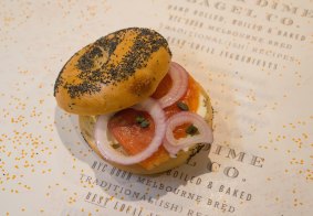Made by hand: The Salmon, Red Onion and cream cheese on a poppy-seed bagel served at 5 and Dime Bagel.