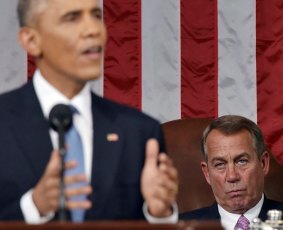 House Speaker John Boehner listens as US President Barack Obama delivers his State of the Union address on Tuesday.