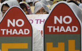 South Korean protesters attend a rally to oppose a deployment of the THAAD anti-missile system.