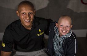 Christos Kyrgios, who has alopecia since he was a child, wants to help mentor children like Caitlin O'Hehir.