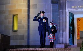Squadron Leader Marcus Watson during the Last Post ceremony for Flight Lieutenant John Napier Bell at the Australian War Memorial in Canberra. 