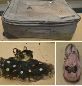 The suitcase in which the remains were found, and a tutu and shoe found with the body.