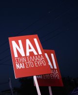 Supporters raise banners for the "NAI" or "Yes" vote during a campaign rally in support of the EU. 