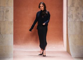 Taking a bow: Victoria Beckham makes a quick catwalk appearance after her latest show in New York.
