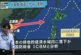 A public TV screen broadcasts news of North Korea's test-firing of its second intercontinental ballistic missile, in Tokyo, Japan. North Korea was the main concern cited in the 'white paper' approved by Japan's cabinet this week.
