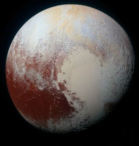 Pluto has reddish patches, showing likely interesting chemical activity on its frozen surface.