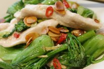Velvet chicken with fried almonds and broccolini.
