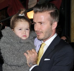 David Beckham and Harper last year.