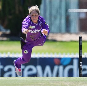 Corinne Hall of the Hobart Hurricanes dives for the ball during the Women's Big Bash League.
