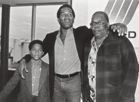 In this 1980 photo, O.J. Simpson, centre, appears at the Buffalo International Airport with his son, Jason, and father Jimmy Lee.