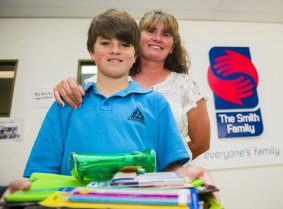 Archie, 11, who is entering year 6 this year with his mum Kylie Reid. The family have been helped by the Smith Family.