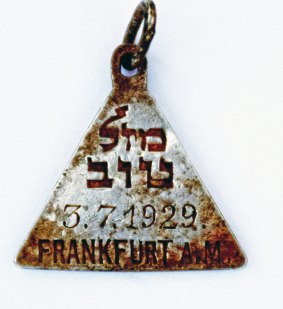 This undated photograph released by the Israel Antiquities Authority shows a pendant that appears identical to one belonging to Anne Frank.