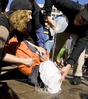 Water-boarding is simulated by protesters outside the US Justice Department in 2007. The forthcoming report on CIA torture reportedly provides new details on the use of water torture by US interrogators.