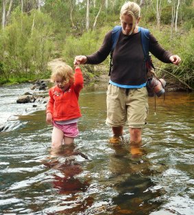 Mrs Yowie helps Emily across the river on the walk to the Big Hole.