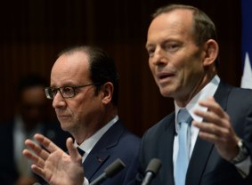 French President Francois Hollande and Prime Minister Tony Abbott at a press conference at Parliament House, in Canberra.