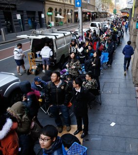 Sold like hotcakes: Australians queued up for new iPhones last year, picking up more than 7 million new phones and tablets in the second half of 2014, creating a mountain of unwanted discarded devices. 