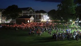 University of Virginia students, faculty and residents attend a candlelight march across grounds in Charlottesville, Virginia. 