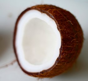 Coconut oil's saturated fat raises cholesterol in the same way as butter and palm oil, the AHA says.