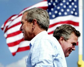 Changing of the guard: George W. Bush and his brother Jeb.