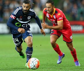 Big workload: Fahid Ben Khalfallah moves in to pass the ball in front of Tarek Elrich.