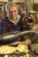 The Lazarus Project's Professor Michael Archer holding a life-sized model of an extinct Marsupial Lion. He has no plans to bring this particular carnivore back to life