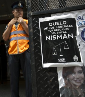 A police officer stands guard in front of he prosecutor's office that leads the investigation of prosecutor Alberto Nisman's death, in Buenos Aires.
