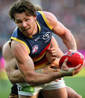 Patrick Dangerfield looks to pass the ball during the round-16 match against Port Adelaide.