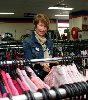 Mrs Abbott browsing for second hand clothes after launching the National Op Shop Week at the Salvation Army store in Manly in 2014.