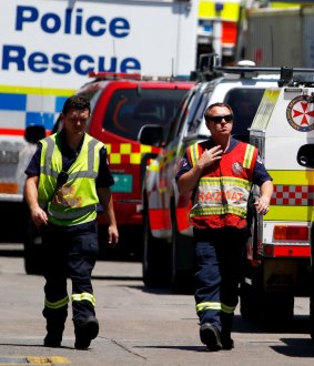 Rescue workers at DIC headqarters where three men were trapped in a tank.