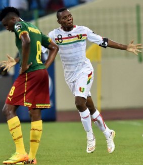 Screamer: Guinea midfielder Ibrahima Traore celebrates after scoring against Cameroon.