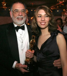Sofia Coppola holds the Oscar she won for best original screenplay for her work on <i>Lost in Translation</i> with her father, Francis Ford Coppola.