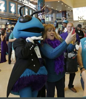 Selfie time: A fan takes a snap alongside Hugo the Hornet.