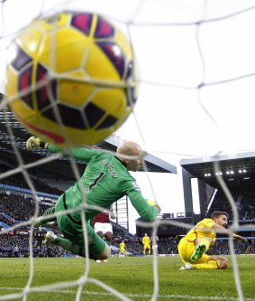 The opener: Fabio Borini puts the ball past Aston Villa goalkeeper Brad Guzan.