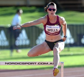 Canberra athlete Lauren Wells on her way to winning the women's 400m hurdles at the Australian Athletics Championships in Brisbane on Sunday.