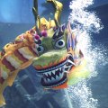 Divers perform an underwater dragon dance at the S.E.A. Aquarium.