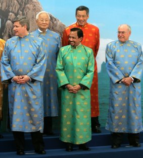 Funny shirts: Can you imagine Donald Trump following the lead of John Howard (right) at the 2006 APEC summit?