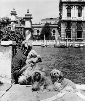 Guggenheim with her pet dogs outside her Venetian palace.