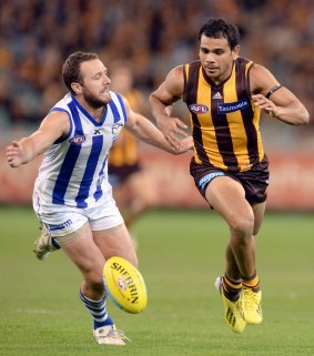 Scott McMahon chases Cyril Rioli at the MCG two years ago.