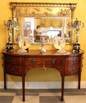 An exceptional George III bow-front flame mahogany sideboard. Provenance L.J. Cook. Estimate:  $8000 to $12,000.