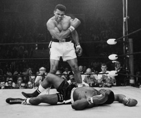 Heavyweight champion Muhammad Ali stands over fallen challenger Sonny Liston in 1964. 