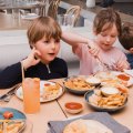 Children enjoy a Greek food fix (and chips!) at Topikos in Bondi Beach.