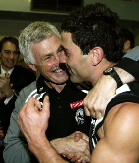 Malthouse greets Paul Licuria in the rooms after Collingwood defeated Port Adelaide in the first qualifying final in 2002.
