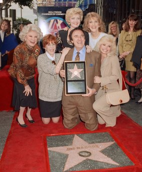 Nabors poses with actresses Phyllis Diller, Carol Burnett, Florence Henderson, Ruth Buzzi and Loni Anderson and his Hollywood Walk of Fame star in 1991.
